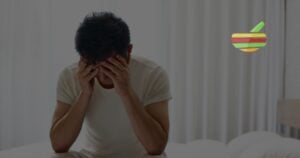 Photo of Man sitting on his bed eith erectile dysfunction