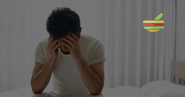 Photo of Man sitting on his bed eith erectile dysfunction