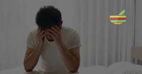 Photo of Man sitting on his bed eith erectile dysfunction